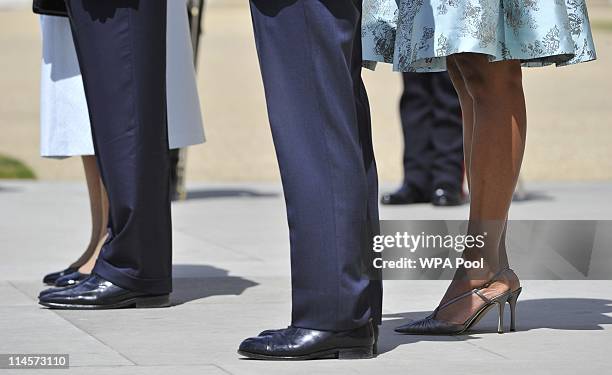 Queen Elizabeth II, US President Barack Obama, Prince Philip, Duke of Edinburgh and US First Lady Michelle Obama stand to listen to the US National...