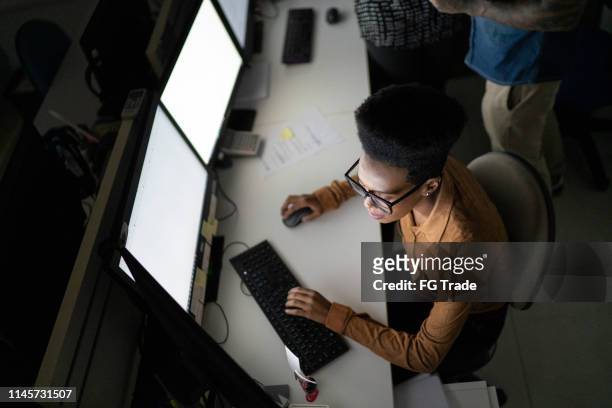 high angle view of businesswoman working late in the office - reading glasses top view stock pictures, royalty-free photos & images
