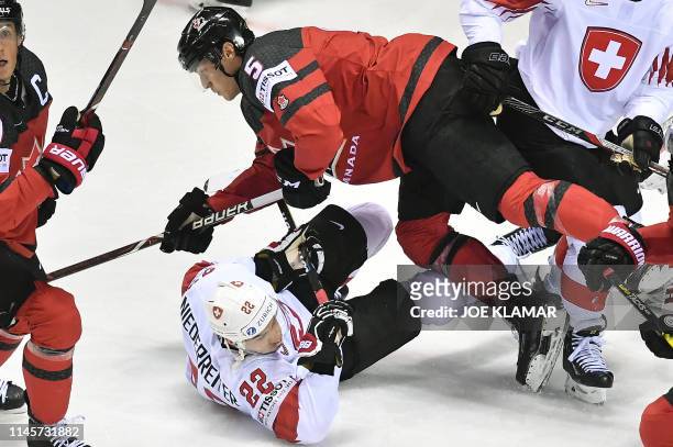 Switzerland's forward Nino Niederreiter and Canada's defender Philippe Myers vie for the puck during the IIHF Men's Ice Hockey World Championships...