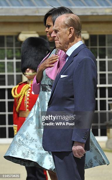 First Lady Michelle Obama stands with Prince Philip, Duke of Edinburgh during the US National Anthem at Buckingham Palace on May 24, 2011 in London,...