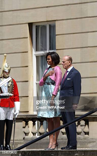 First Lady Michelle Obama stands with Prince Philip, Duke of Edinburgh during the US National Anthem at Buckingham Palace on May 24, 2011 in London,...