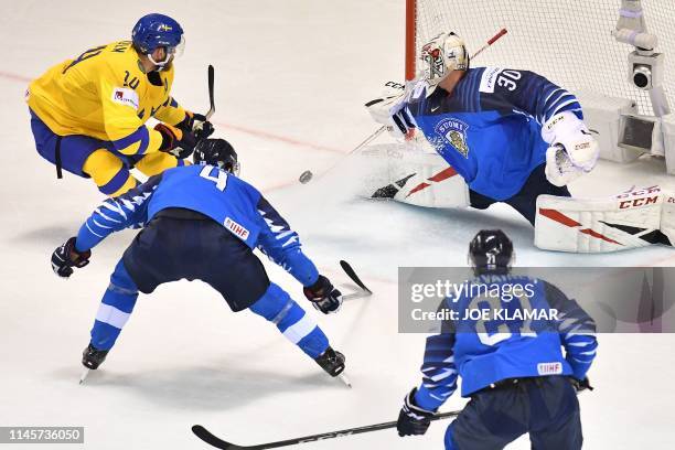 Sweden's defender Mattias Ekholm has his shot stopped by Finland's goalkeeper Kevin Lankinen during the IIHF Men's Ice Hockey World Championships...
