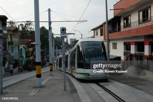 Ayacucho Tram in seen in a neighbourhood on February 13, 2019 in Medellin, Colombia. The Ayacucho Tram is a Translohr tram system that serves the...