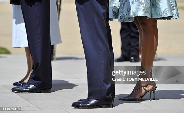 Britain's Queen Elizabeth II, US President Barack Obama, Prince Philip, the Duke of Edinburgh and US First Lady Michelle Obama stand as they listen...