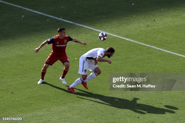 Chris Pontius of Los Angeles Galaxy battles Donny Toia of Real Salt Lake for a loose ball during the first half of a game at Dignity Health Sports...
