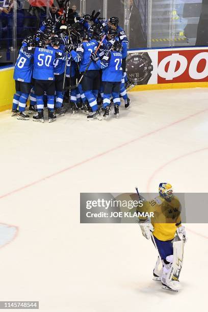 Finland's players celebrate winning the IIHF Men's Ice Hockey World Championships quarter-final match between Finland and Sweden on May 23, 2019 at...