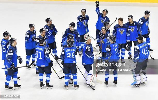 Finland's players celebrate winning the IIHF Men's Ice Hockey World Championships quarter-final match between Finland and Sweden on May 23, 2019 at...