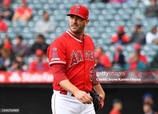 Matt Harvey of the Los Angeles Angels of Anaheim walks into the dugout after giving up six runs in the first inning to the Minnesota Twins at Angel...