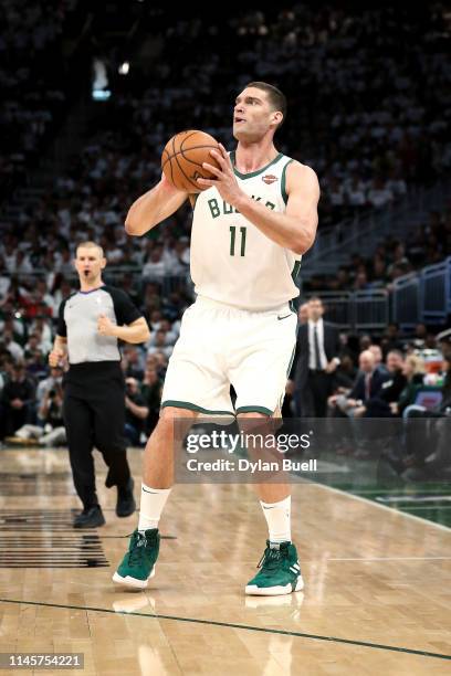 Brook Lopez of the Milwaukee Bucks attempts a shot in the fourth quarter against the Boston Celtics during Game One of Round Two of the 2019 NBA...