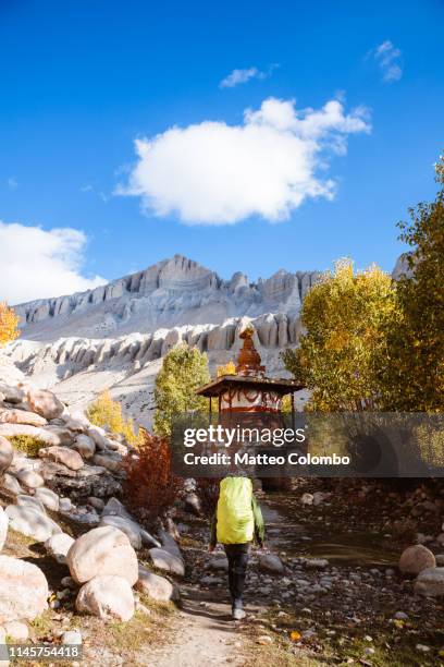 hiker near small stupa, upper mustang region, nepal - mustang imagens e fotografias de stock