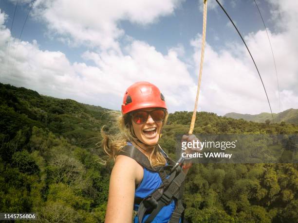 ziplining mama in the jungle - ziplining stock pictures, royalty-free photos & images