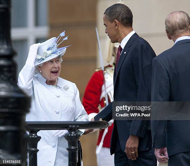 Queen Elizabeth II and US President Barack Obama review an honour guard of the First Battalion Scots Guards at a ceremony of welcome at Buckingham...