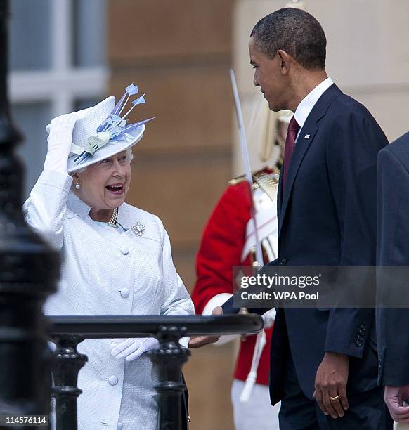 Queen Elizabeth II and US President Barack Obama review an honour guard of the First Battalion Scots Guards at a ceremony of welcome at Buckingham...