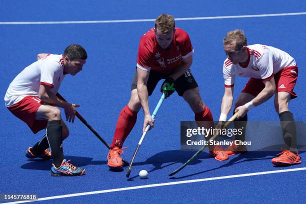 Johnston Gordon#16 battlles with Belarus defenders during the FIH Series Finals between Canada and Belarus at the Bukit Jalil National Hockey Stadium...