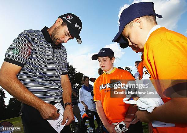 Padraig Harrington signs autographs for children from Ascot Heath C of E Junior School and Harmanswater Primary School during an R&A Working for Golf...