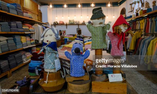 Wool made figure representing Little Red Hood, the hunter, the bad wolf and the grandmother on display at ChiCoração - Boutique Sé in one of the...