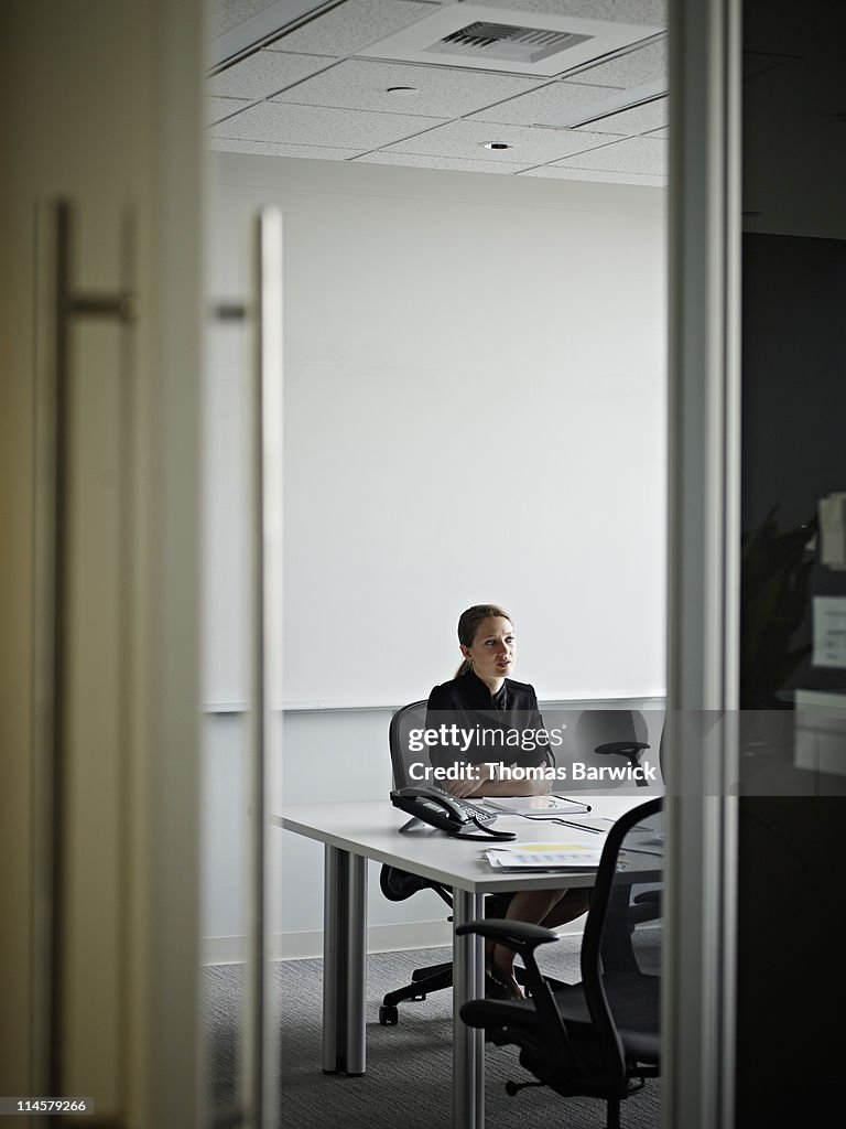 Businesswoman sitting in conference room