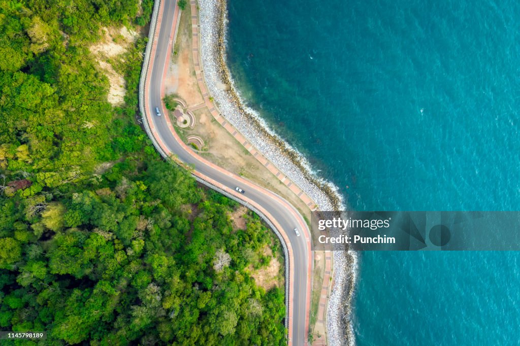 Aerial view of the road between the mountains and the sea