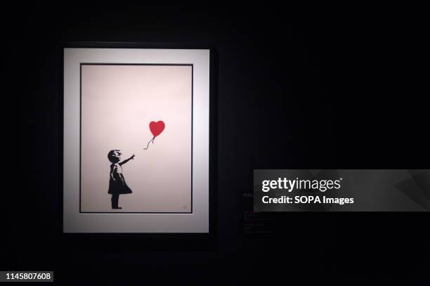 Painting of 'Girl with a balloon' seen during the exhibition. 'Banksy The art of Protest' at cultural center 'La Térmica' is an exhibition showing...