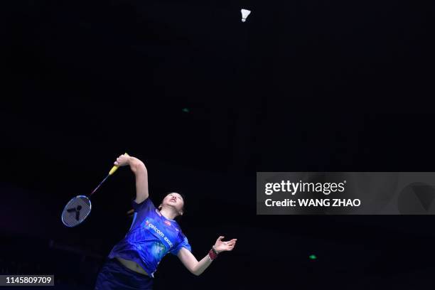 Malaysia's Soniia Cheah hits a return against Japan's Nozomi Okuhara during their women's singles quarter-final match at the 2019 Sudirman Cup world...