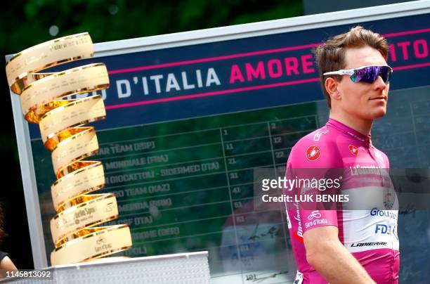 Team Groupama-FDJ rider France's Arnaud Demare, wearing the Cyclamen jersey of King of the General Point Classification, walks past the Giro Trophy...