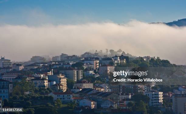 Early morning fog partially covers parts of the city on April 28, 2019 in Coimbra, Portugal. The city, dating from Roman times, is well know for its...
