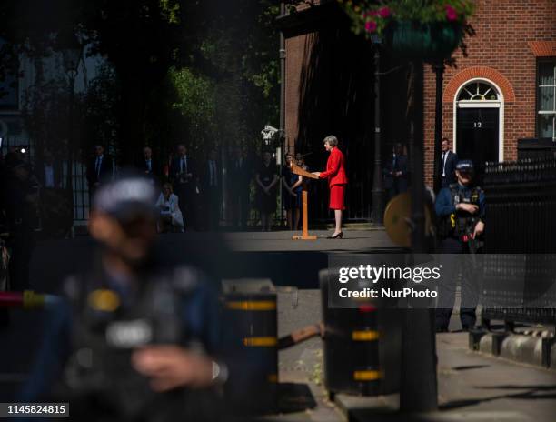 Police stand guard as Theresa Maythe British Prime Minister is seen talking to the press outside 10 Downing street in London, United Kingdom. 24 May...