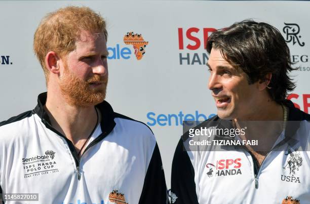 Britain's Prince Harry and St. Regis team captain Argentine Nacho Figueras pose following the charity polo match the Sentebale ISPS Handa Polo Cup at...