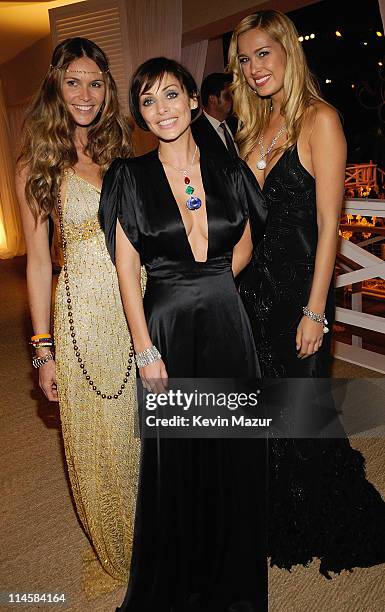 Model Elle MacPherson wearing a selection of yellow gold Chopard Jewellery, Natalie Imbruglia, wearing a pendant composed of a 23.59ct spinel...