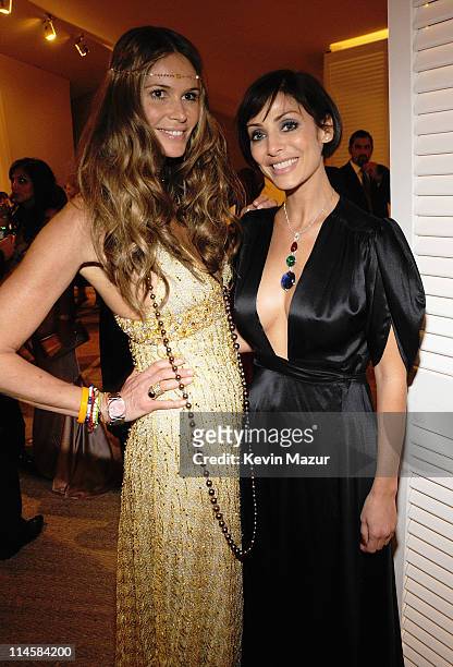 Model Elle MacPherson wearing a selection of yellow gold Chopard Jewellery and Natalie Imbruglia, wearing a pendant composed of a 23.59ct spinel...