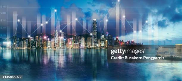 double exposure business technology at abstract financial charts in sky on city background. business information concept - man double exposure profit concept stock-fotos und bilder