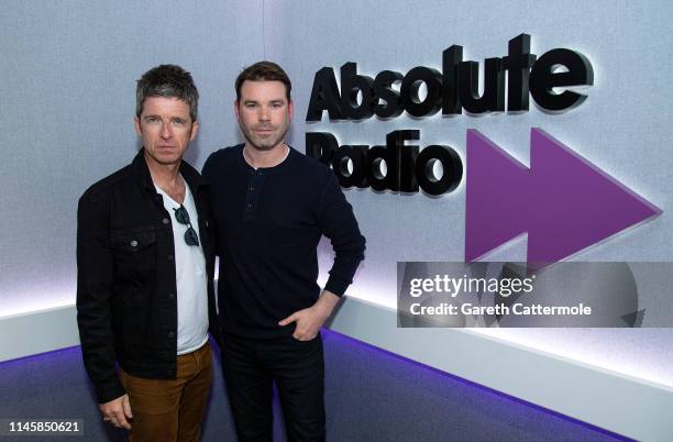 Noel Gallagher poses for a photo with Presenter Dave Berry during a visit to Absolute Radio on April 29, 2019 in London, England.