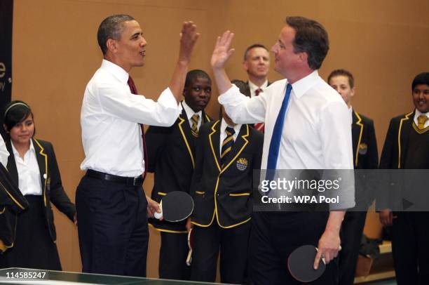 President Barack Obama and British Prime Minister David Cameron play table tennis at Globe Academy on May 24, 2011 in London, England. The 44th...