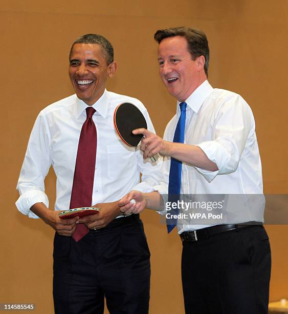 President Barack Obama and British Prime Minister David Cameron play table tennis at Globe Academy on May 24, 2011 in London, England. The 44th...