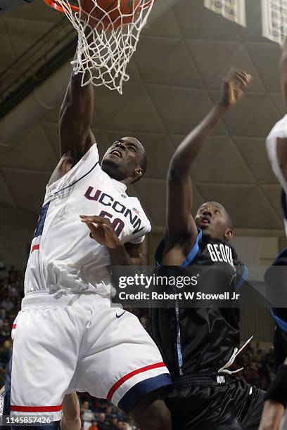 University of Connecticut basketball player Emeka Okafor dunks in two points against Georgetown, Hartford, Connecticut, June 25, 2002.