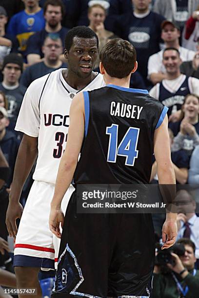 University of Connecticut player Denham Brown has words with Georgetown's Matt Causey during a game, Hartford, Connecticut, June 25, 2002.
