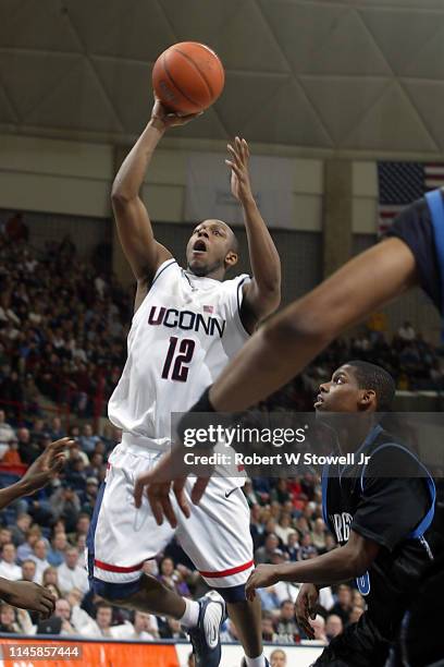 University of Connecticut point guard Taliek Brown elevates for a shot against Georgetown, Hartford, Connecticut, June 25, 2002.