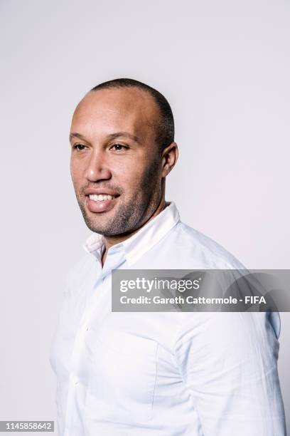 Mikael Silvestre poses during a FIFA portrait session on December 7, 2018 in Paris, France.