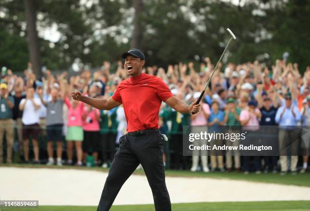 Tiger Woods of the United States celebrates on the 18th green after winning the Masters at Augusta National Golf Club on April 14, 2019 in Augusta,...