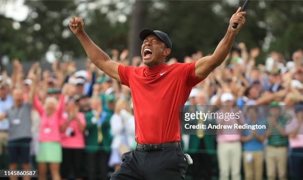 Tiger Woods of the United States celebrates on the 18th green after winning the Masters at Augusta National Golf Club on April 14, 2019 in Augusta,...