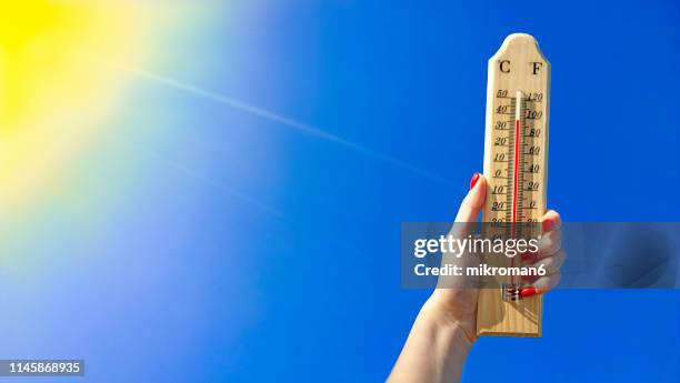 thermometer against a bright blue sky - 熱波 ストックフォトと画像