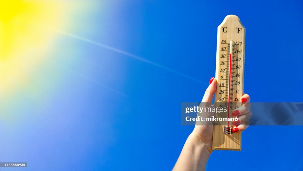 Thermometer Against a Bright Blue Sky