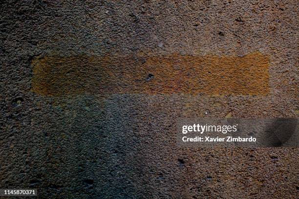 Dark concrete texture background of a wall with a line