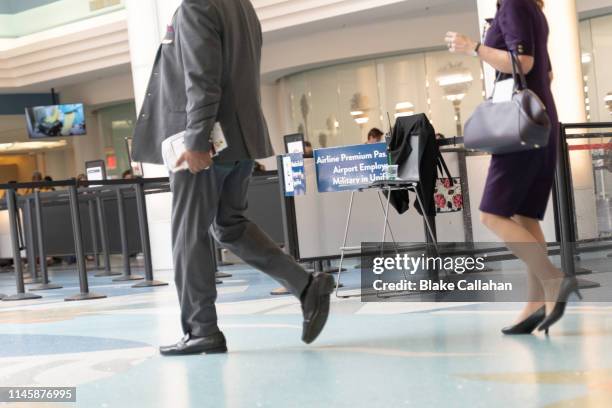 business man and women walking at the airport - man with wings flying white background bildbanksfoton och bilder