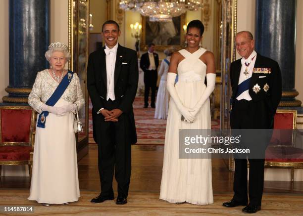 Queen Elizabeth II poses with U.S. President Barack Obama, his wife Michelle Obama and Prince Philip, Duke of Edinburgh in the Music Room of...