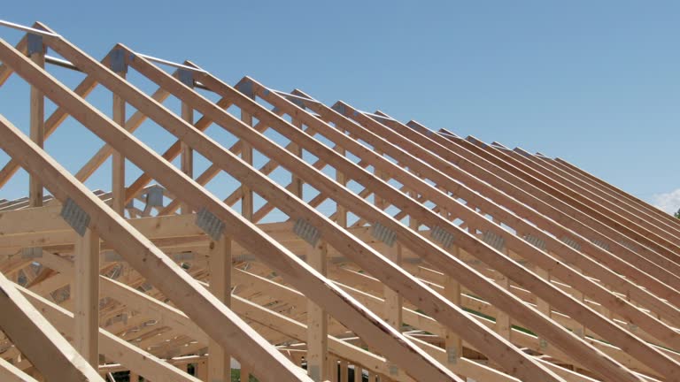 https://media.gettyimages.com/id/1145878312/video/aerial-drone-shot-of-a-row-of-wooden-roof-trusses-of-a-framed-house-on-a-construction-site-on.jpg?b=1&s=640x640&k=20&c=Tl5wZC3GcTO3g351ZINHszhHBXNJf7SzNNXExdV0cTs=