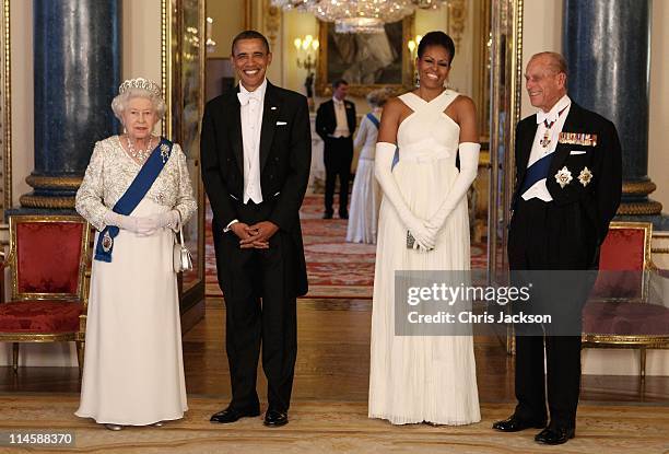 Queen Elizabeth II, U.S. President Barack Obama, his wife Michelle Obama and Prince Philip, Duke of Edinburgh pose in the Music Room of Buckingham...