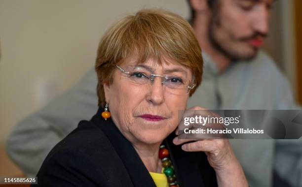 United Nations High Commissioner for Human Rights, Michelle Bachelet, listens to the meeting introduction before delivering opening remarks while...