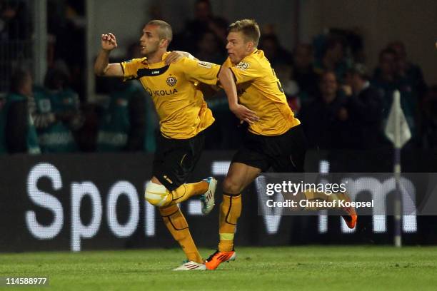 Dani Schahin of Dresden celebrates the second goal with Alexander Esswein of Dresden during the Second Bundesliga play-off second leg match between...