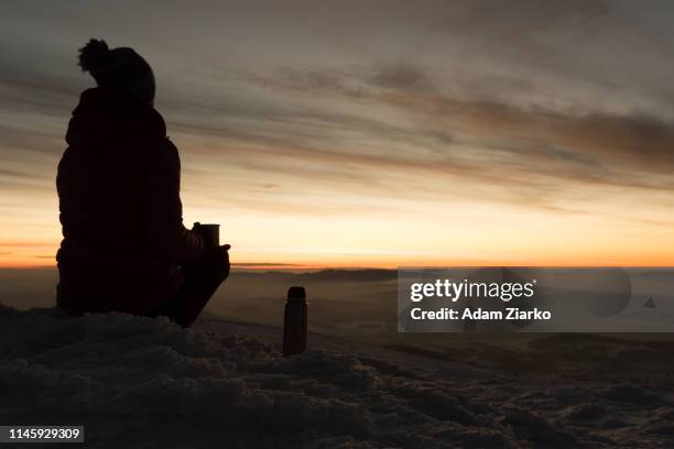 hiker woman drinking tea on the mountain ridge - babia góra mountain stock pictures, royalty-free photos & images